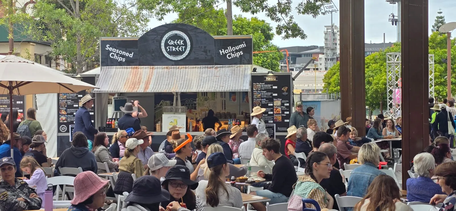 A full house of diners seated in front of the Greek Street stall at a show